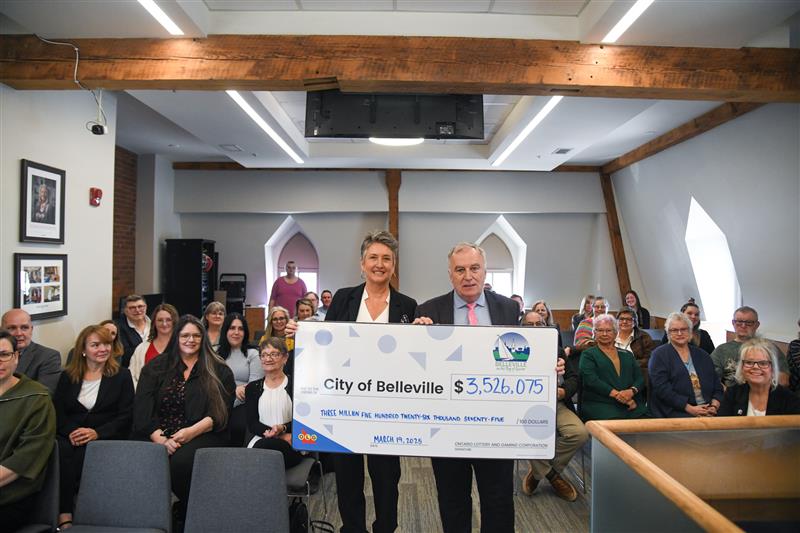 Mayor holding a cheque