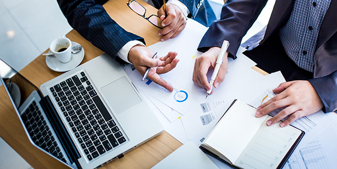 two people working on financial projections