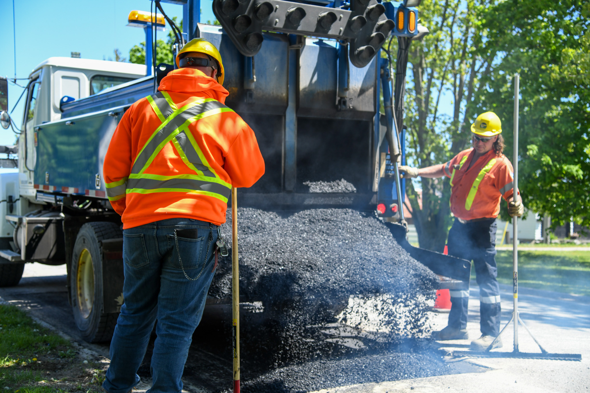 city workers paving roads