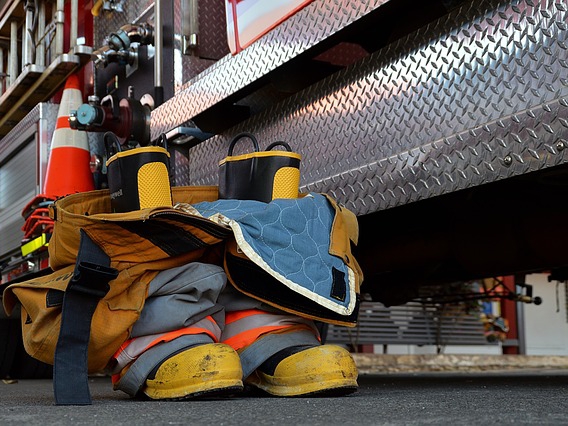 Fire boots beside Fire Truck