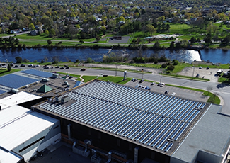 Aerial photo of solar panels on top of the Quinte Sports and Wellness Centre.