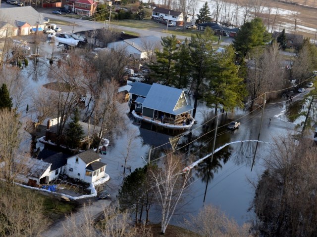 house surrounded by floodwater