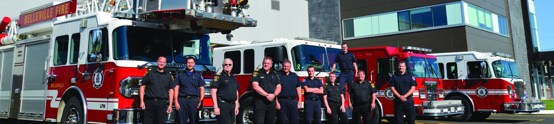 Belleville Fire Department Staff in front of Firetrucks
