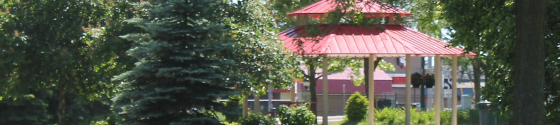 trees with pavilion in background