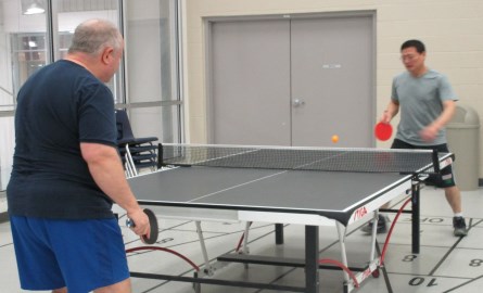 two men playing table tennis