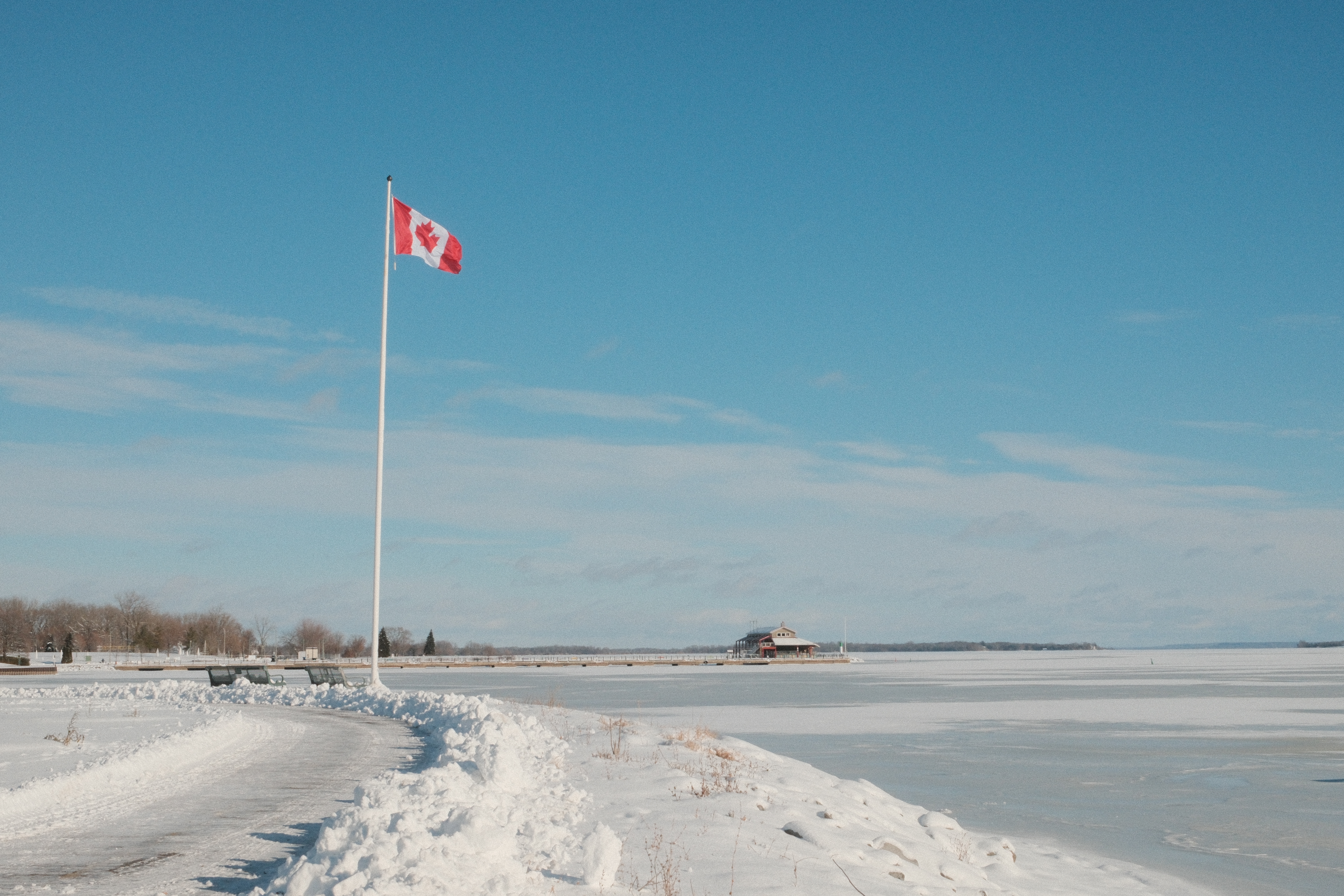 Trail with Canada flag along frozen Bay of Quinte