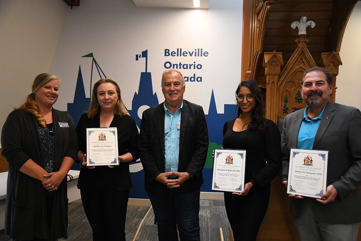 Photo with representatives from Downtown Belleville, Habitat for Humanity and Holiday Inn Express with Mayor Neil Ellis.