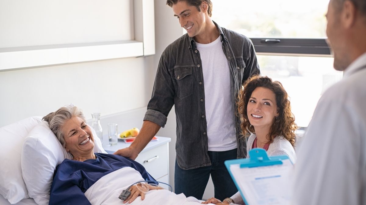 Doctor speaks to patient and family