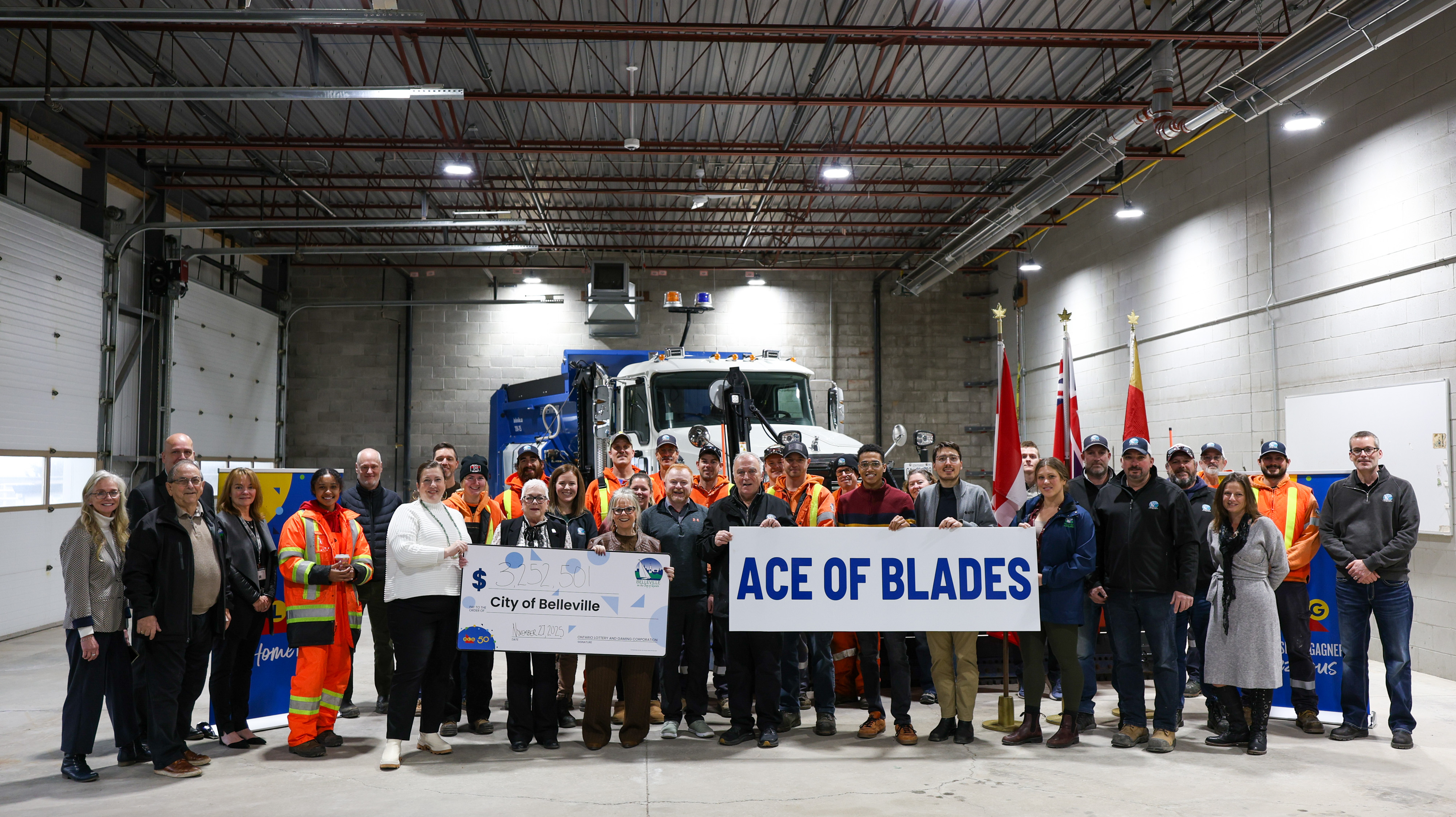 Mayor, Council, OLG representatives and City staff stand in front of new 