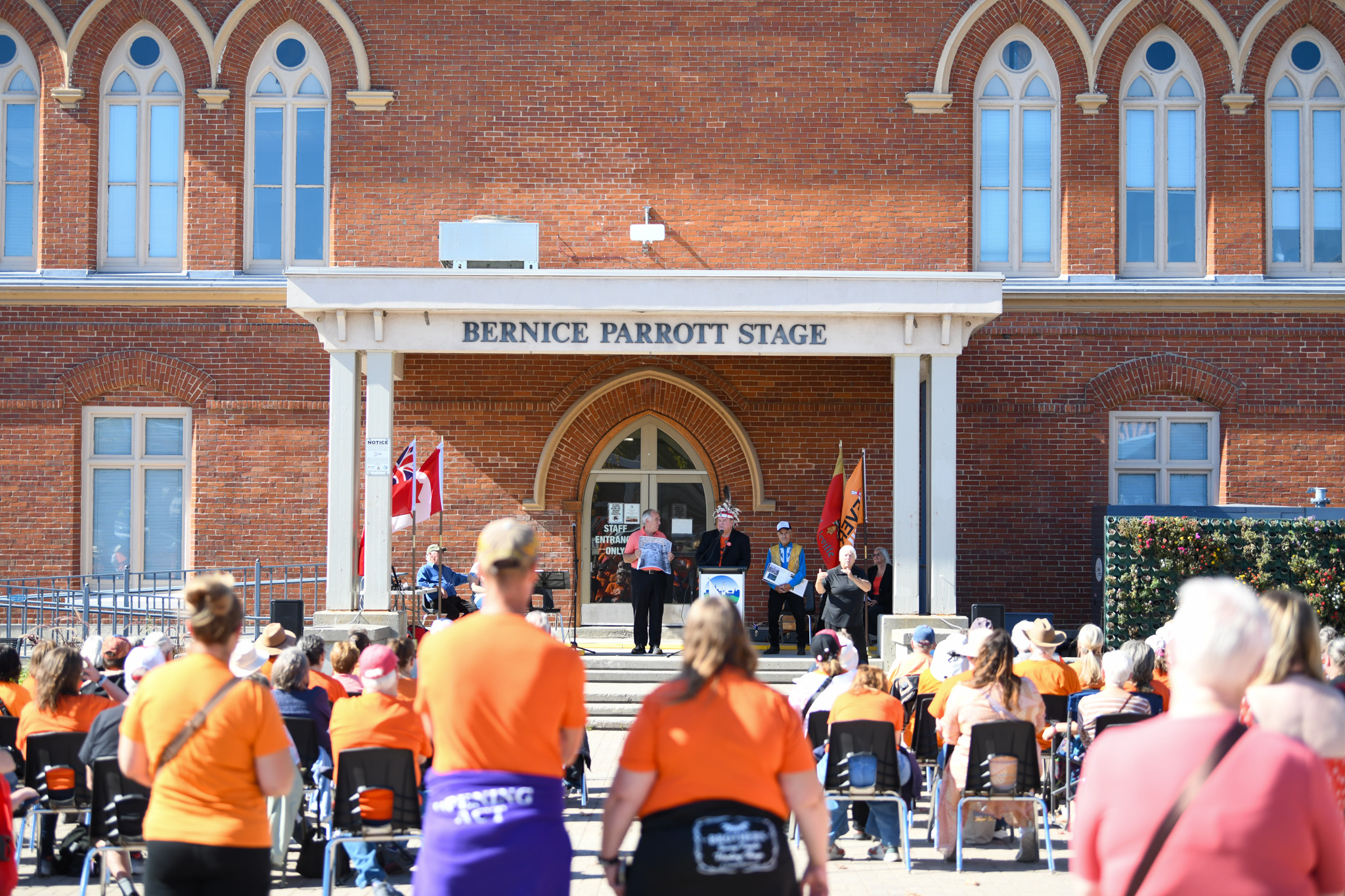 Photo of people wearing orange shirts in Market Square.