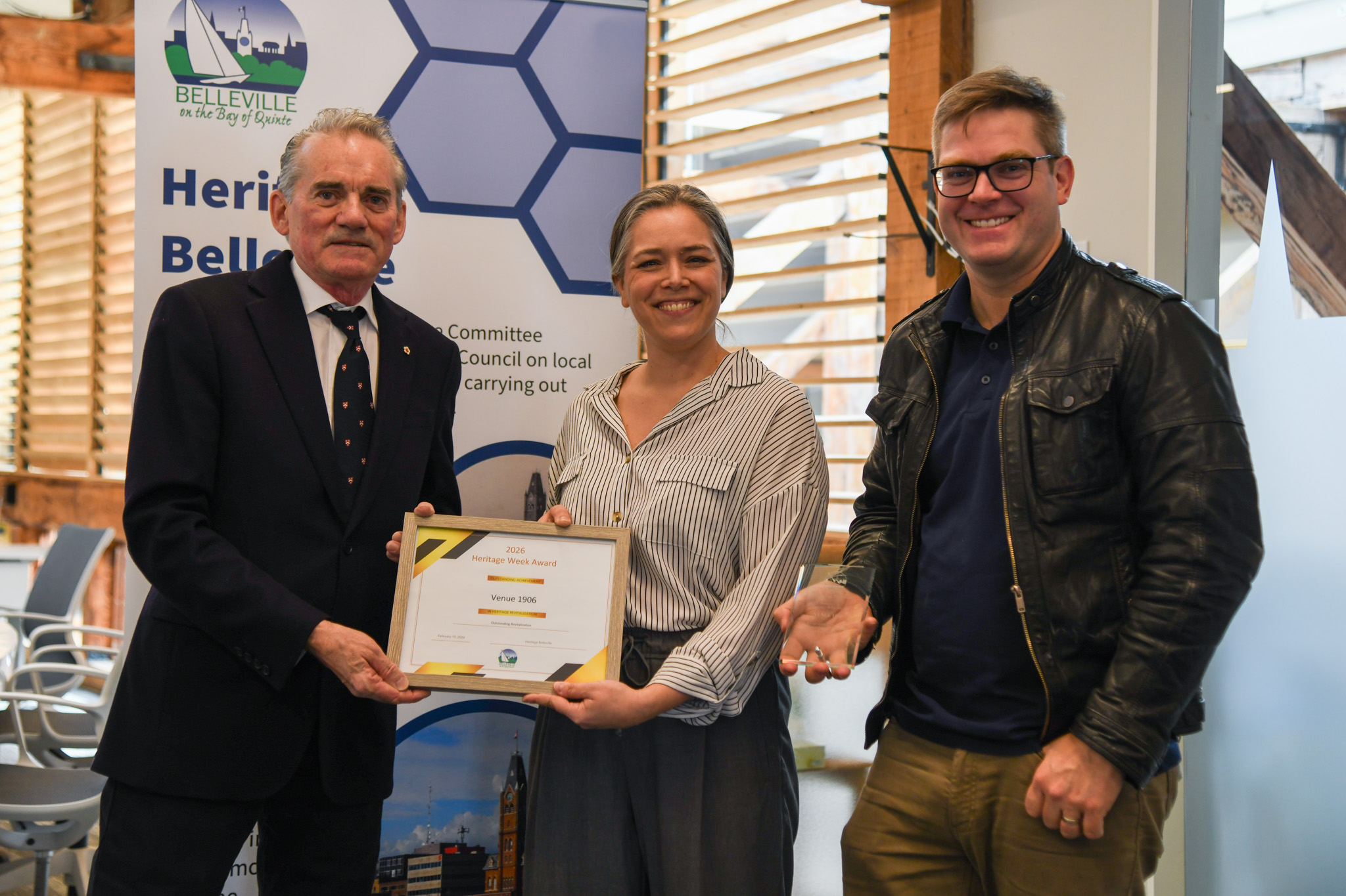 Venue 1909 owners accepting award in council chamber