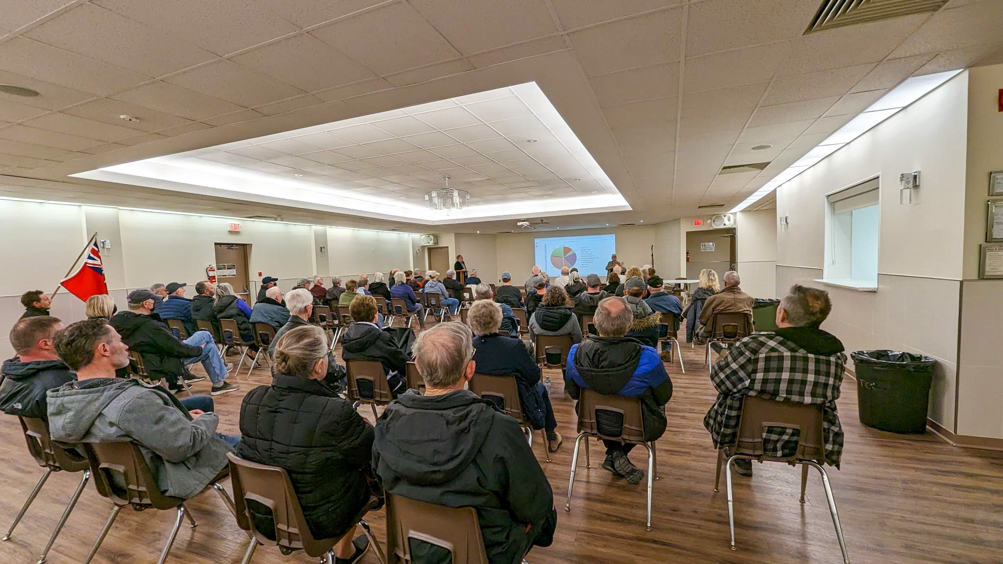 crowd sitting in a room