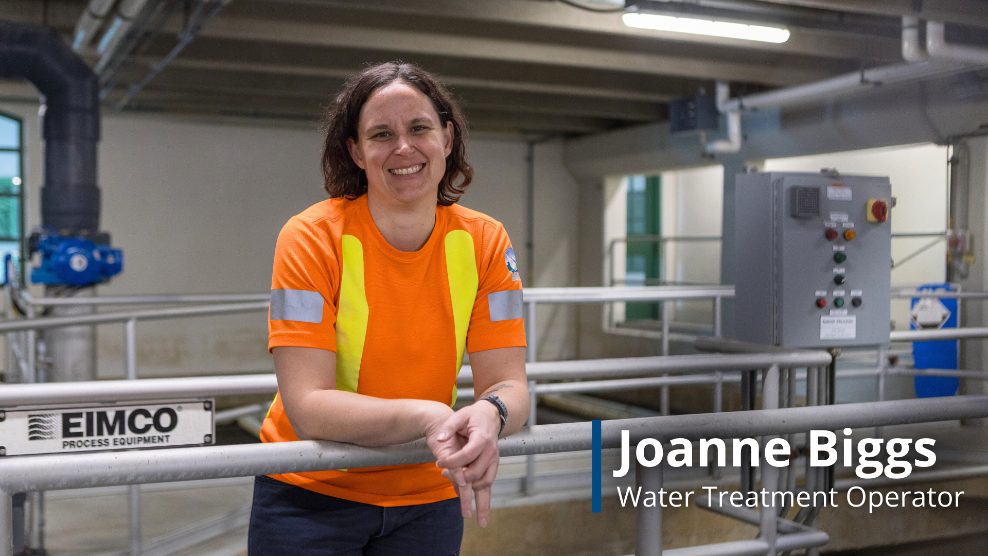 A photo of Joanne Biggs, a Water Treatment Operator leaning against a railing at the water treatment plant.