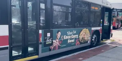Example of Bus Exterior - Vinyl on on curbside area of bus