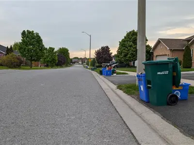 Waste bins along road in subdivision